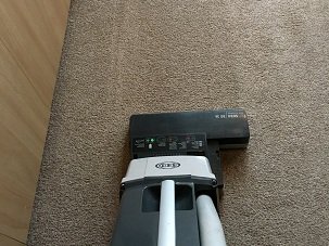 Carpet being vacuummed by iNEX