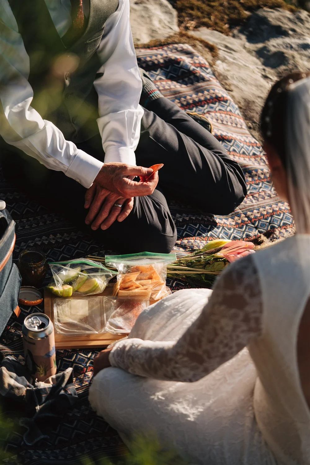 Couple standing together during a mountain elopement at sunset