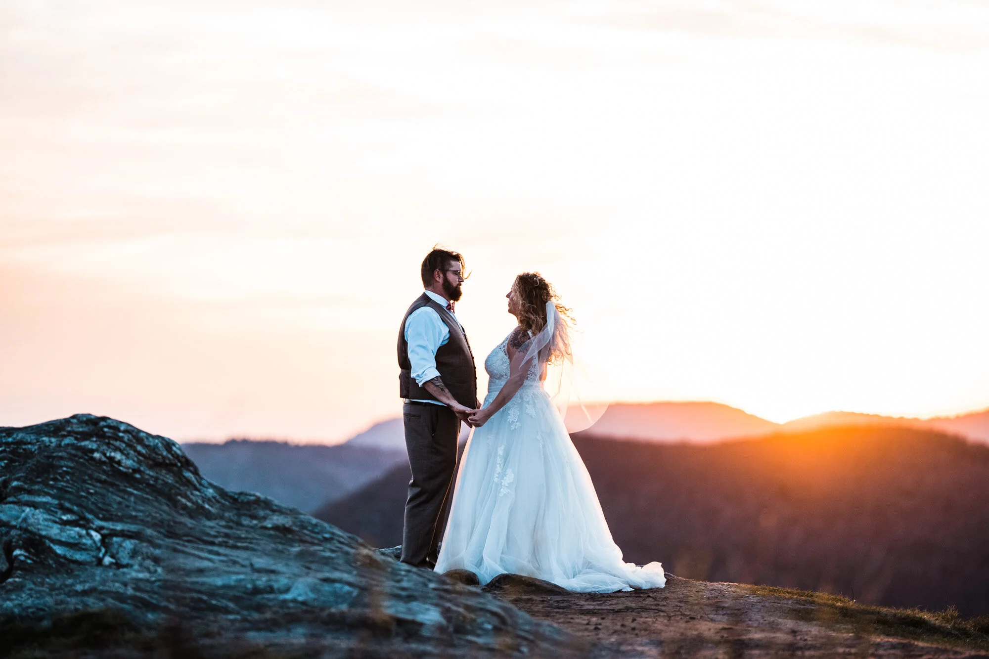 Kimb and Roland together at sunset in the Blue Ridge Mountains after their intimate Brevard wedding