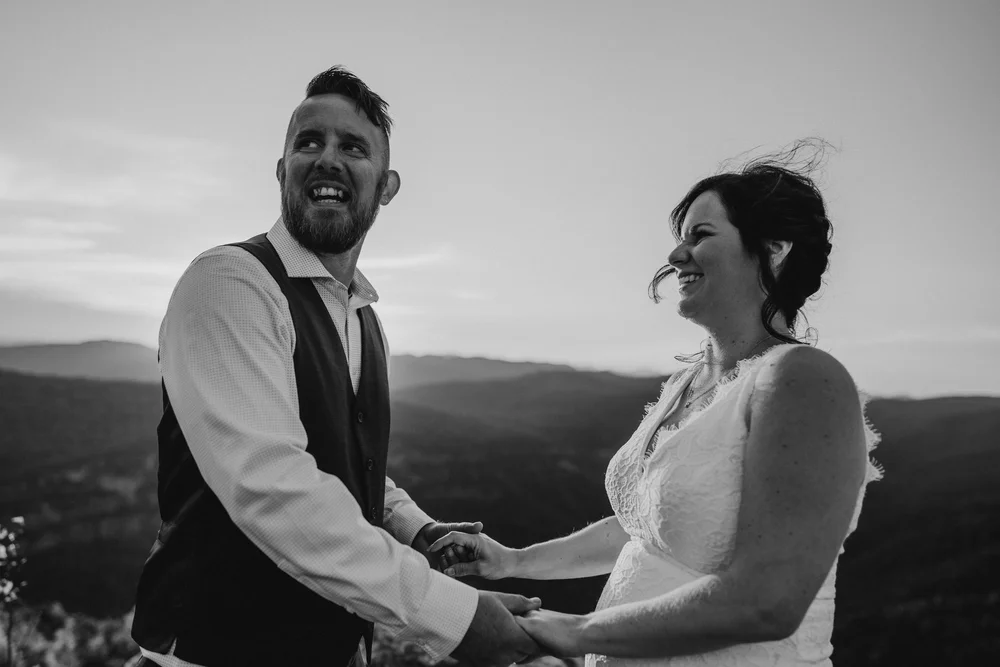 Andrea and Adam laughing together after their Linville Gorge wedding ceremony