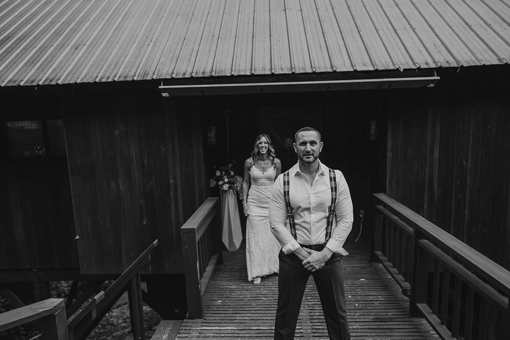 Couple preparing to share a first look before their wedding ceremony