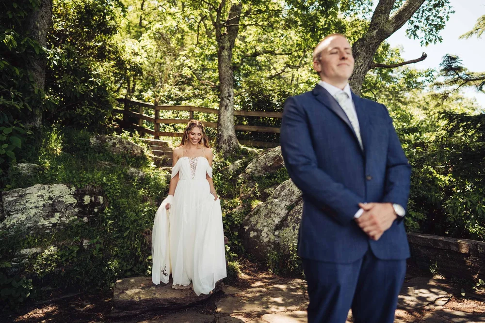 Kaitlyn walking toward Evan for their first look before their Chestoa View elopement ceremony