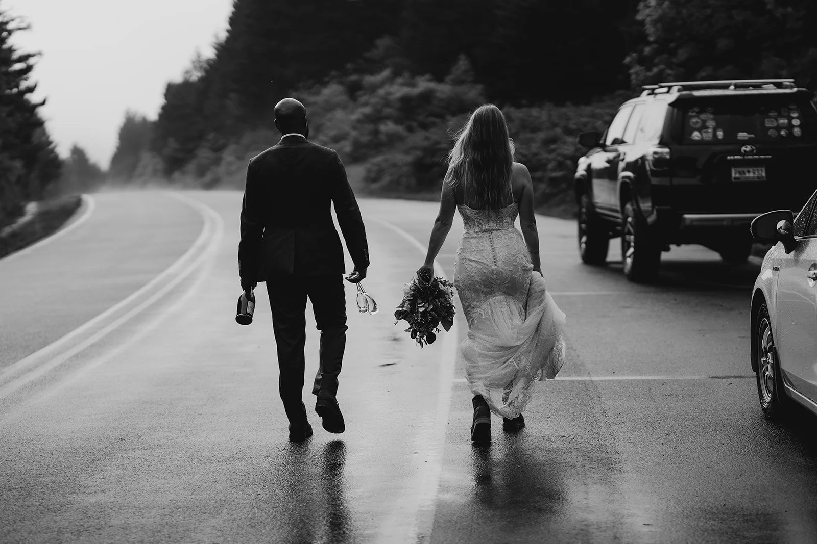 Couple holding hands on the road near Black Balsam Knob in Western North Carolina