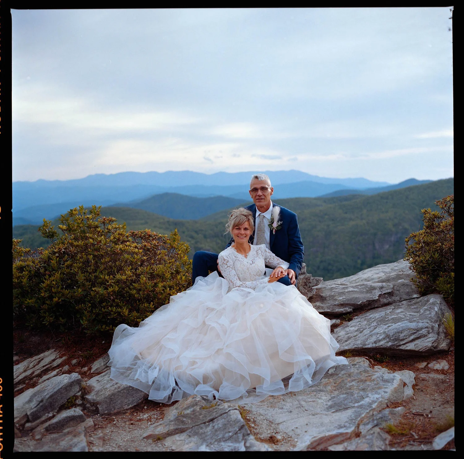 Film photo of a couple during a mountain overlook elopement in Western North Carolina