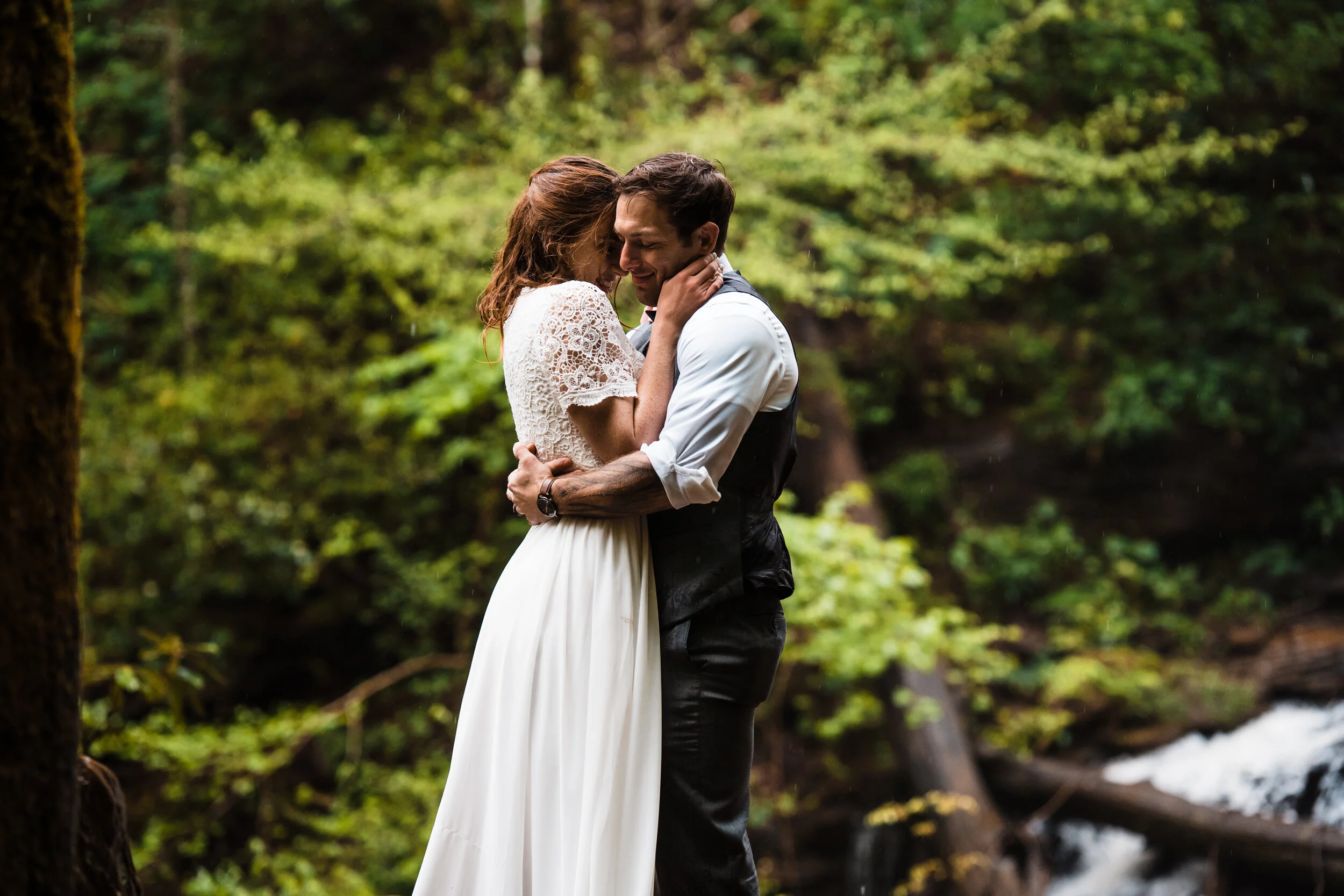 Couple embracing in a forest setting