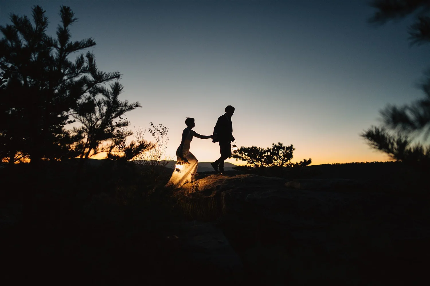 Couple overlooking the Blue Ridge Mountains after a sunset hike elopement