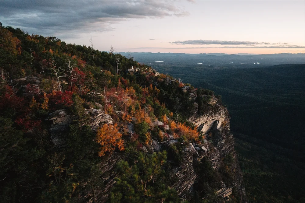 Couple celebrating after a sunset hike elopement in the Blue Ridge Mountains