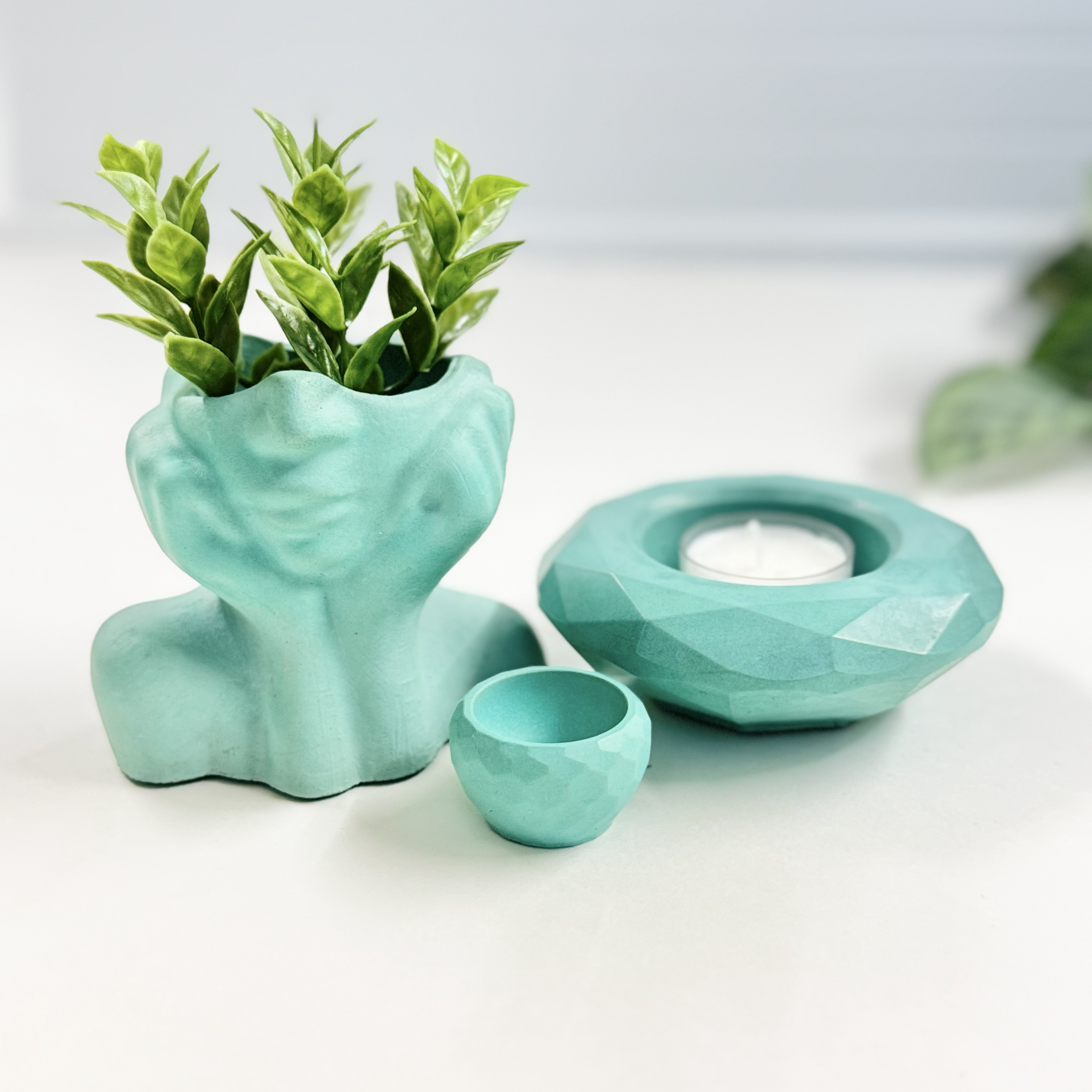 blue vase made from concrete and candle holder