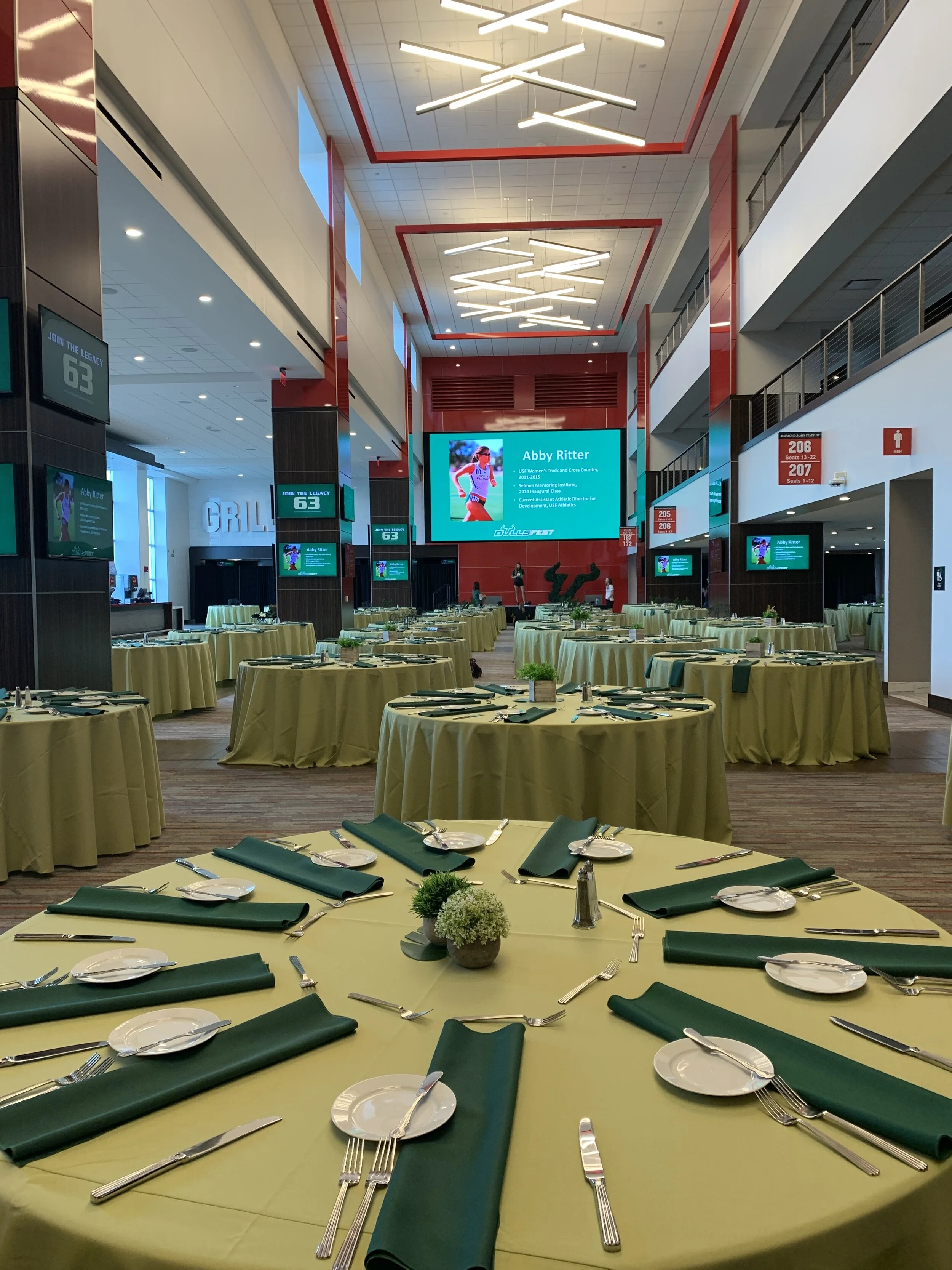 A round table is set in the Hyundai Club North event space. 