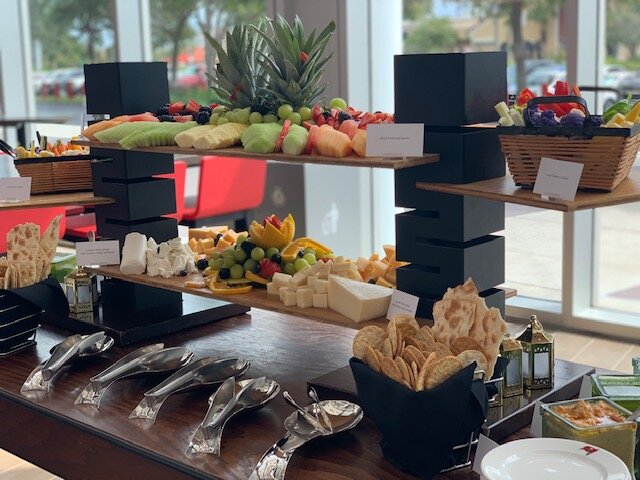 Buffet style fruit and cheese are displayed at Bar 76.