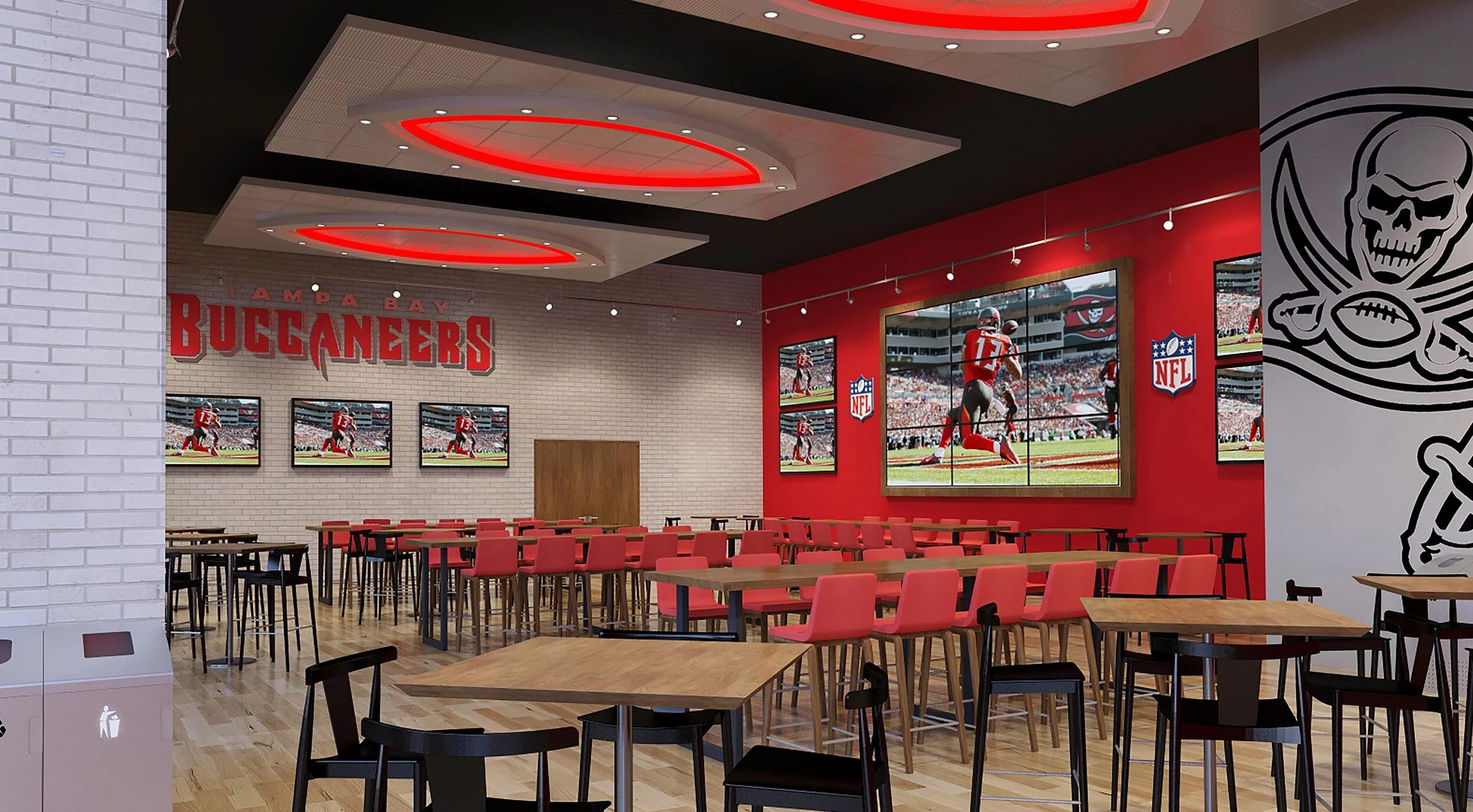Empty tables and red chairs in front of a large screen television in Bar 76. 