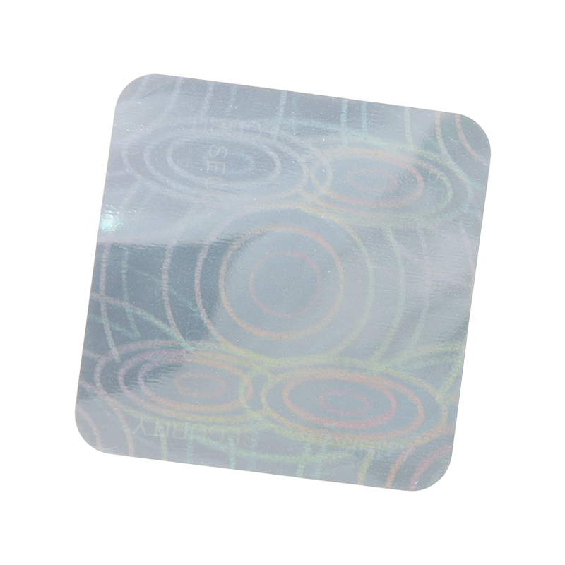 A holographic coaster with swirling circular patterns.