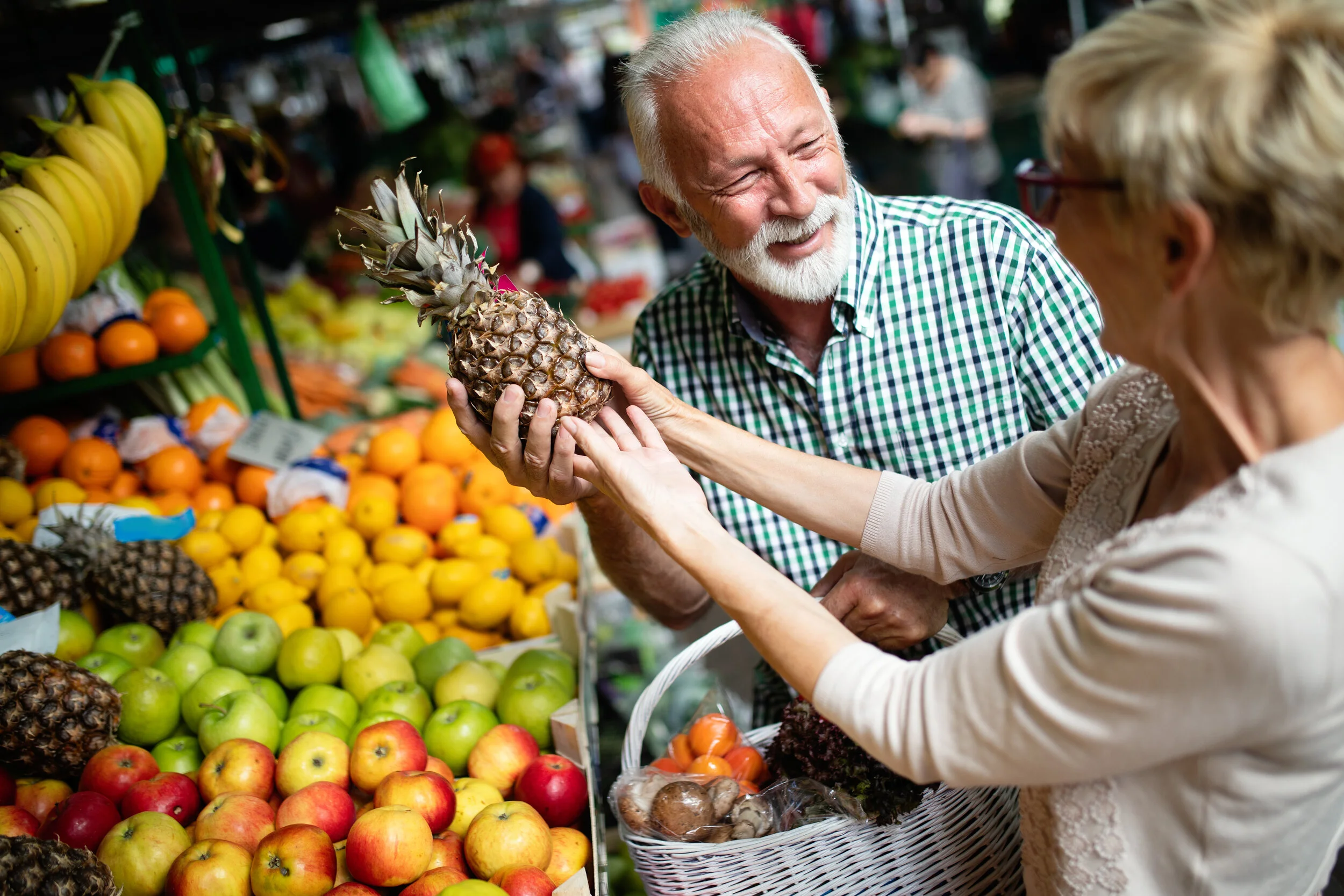 beautiful-senior-couple-choosing-health-products-DXV29F3.jpg