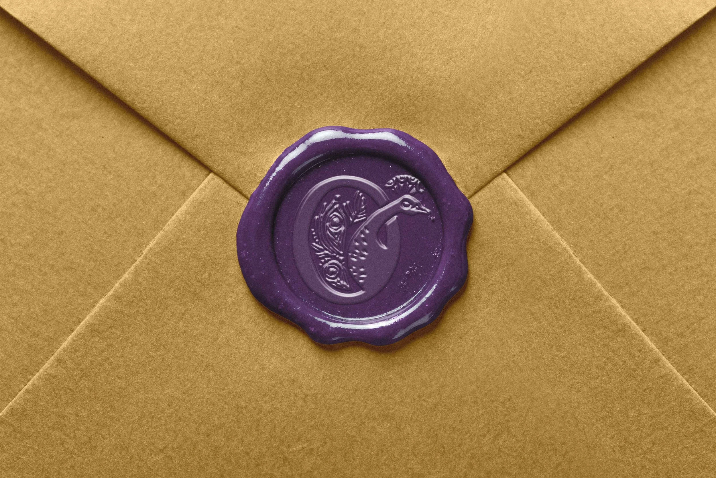 Manilla letter with purple wax seal with an imprint of the Dear Old Farm Logo.