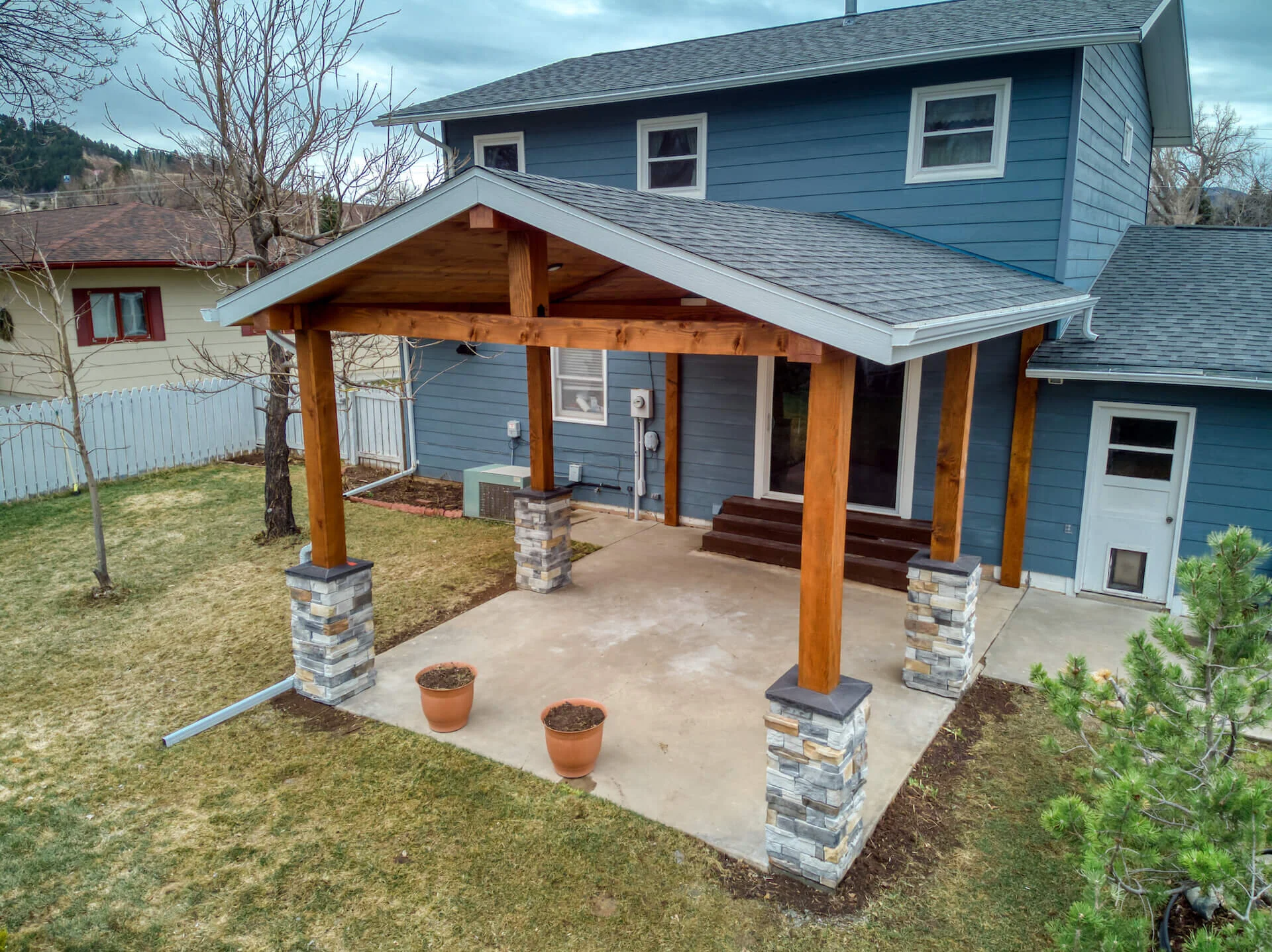Covered Patio Addition by Oaks Construction — Builders FirstSource