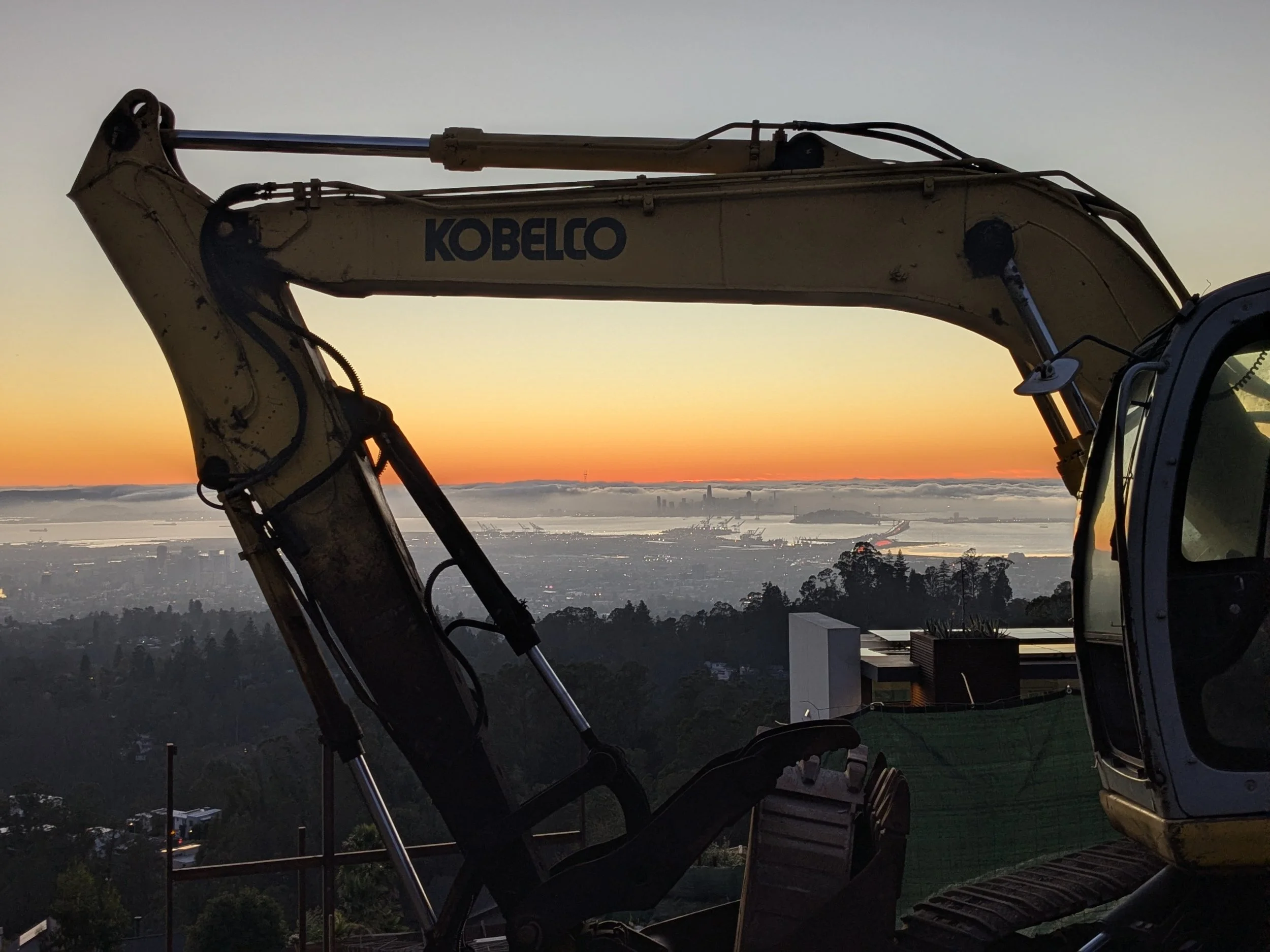 fog city with excavator, oakland hills, california