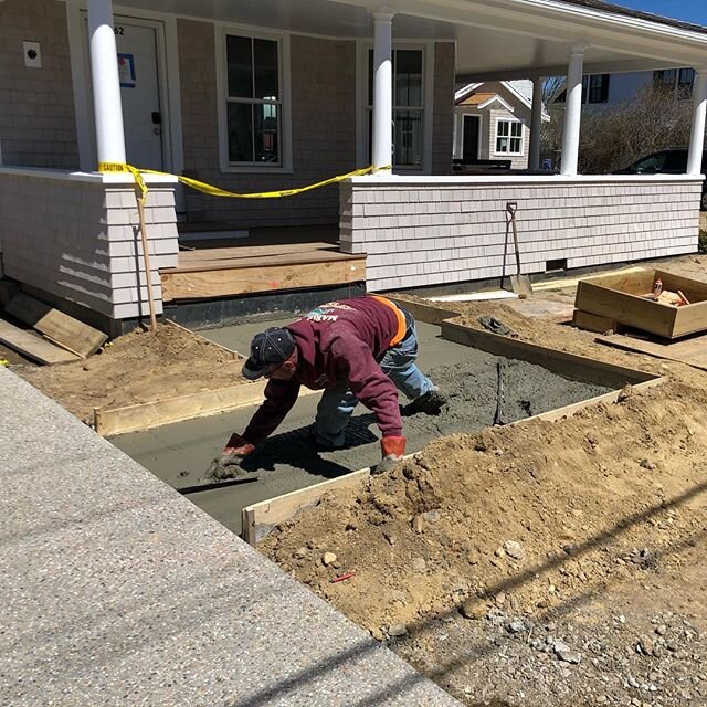Finishing the pad for one of two brick walkways at this Hyannisport home
