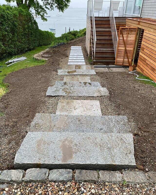 Irregular granite steps with Phoenician granite landings installed in cotuit.