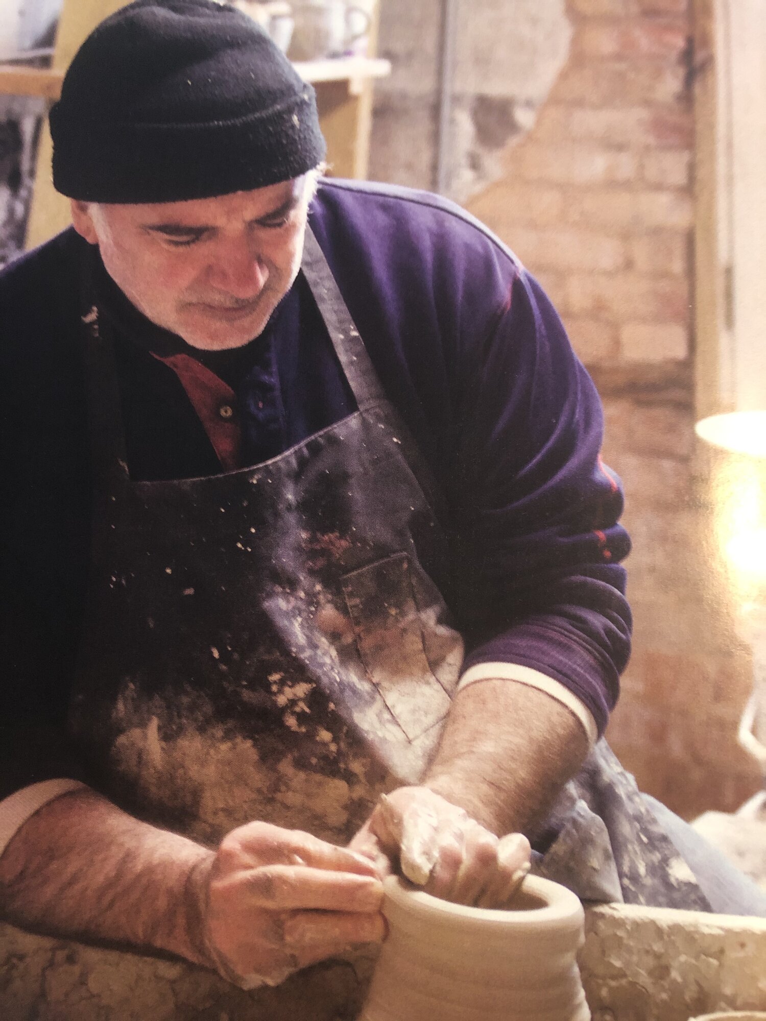 Potter Tom Homann working at the wheel in Comer, GA