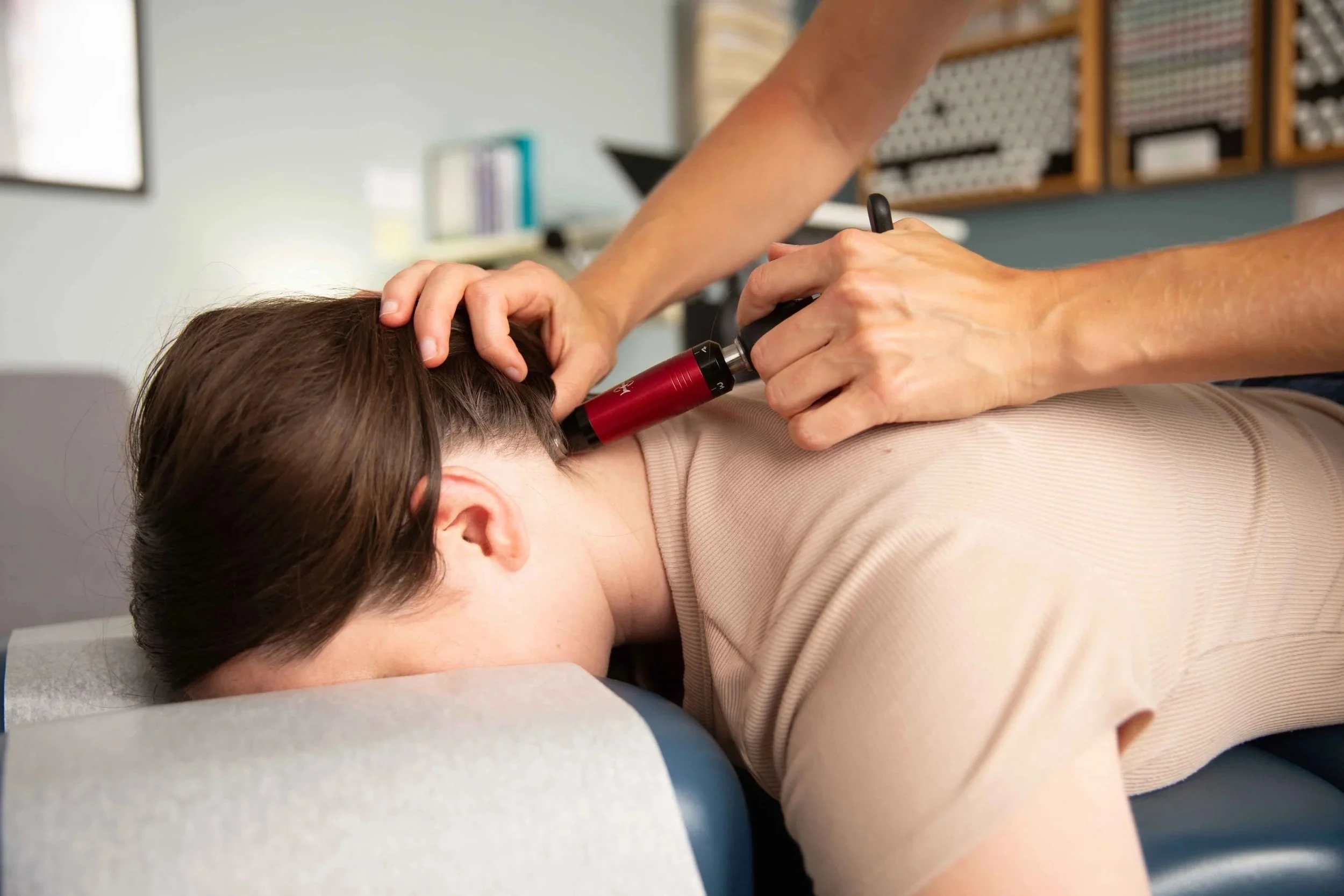 Person receiving acupuncture treatment in a clinical setting.