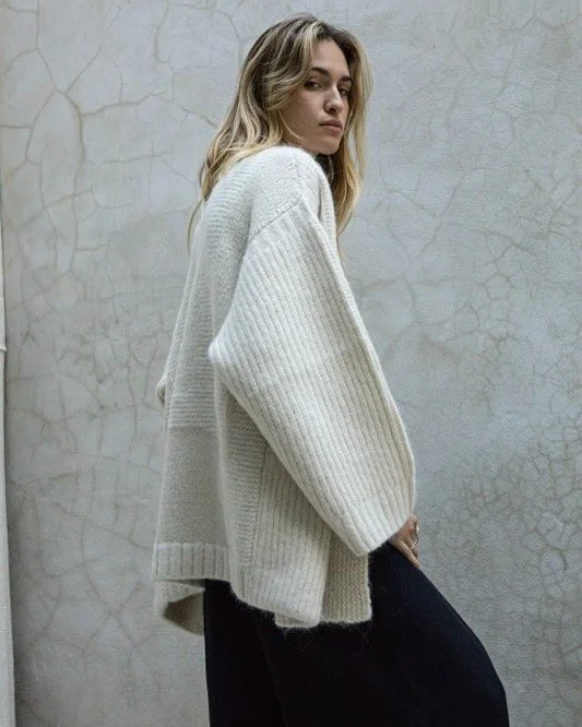 GIFTING IDEA , this week we are offering a 100$ off one of our most luxurious knit pieces , the Eliana cardigan .this  cardigan is such a wonderful gift for a loved one , it feel like a warm cosy hugg and the sunshine intarsia at the back radiate pos