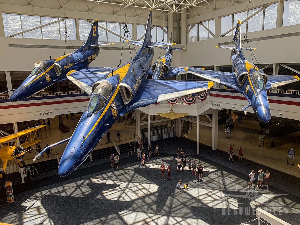 Four examples of the A-4 (Bureau Numbers 150076, 154217, 154983, and 155033) form the diamond formation suspended in the Blue Angel Atrium.