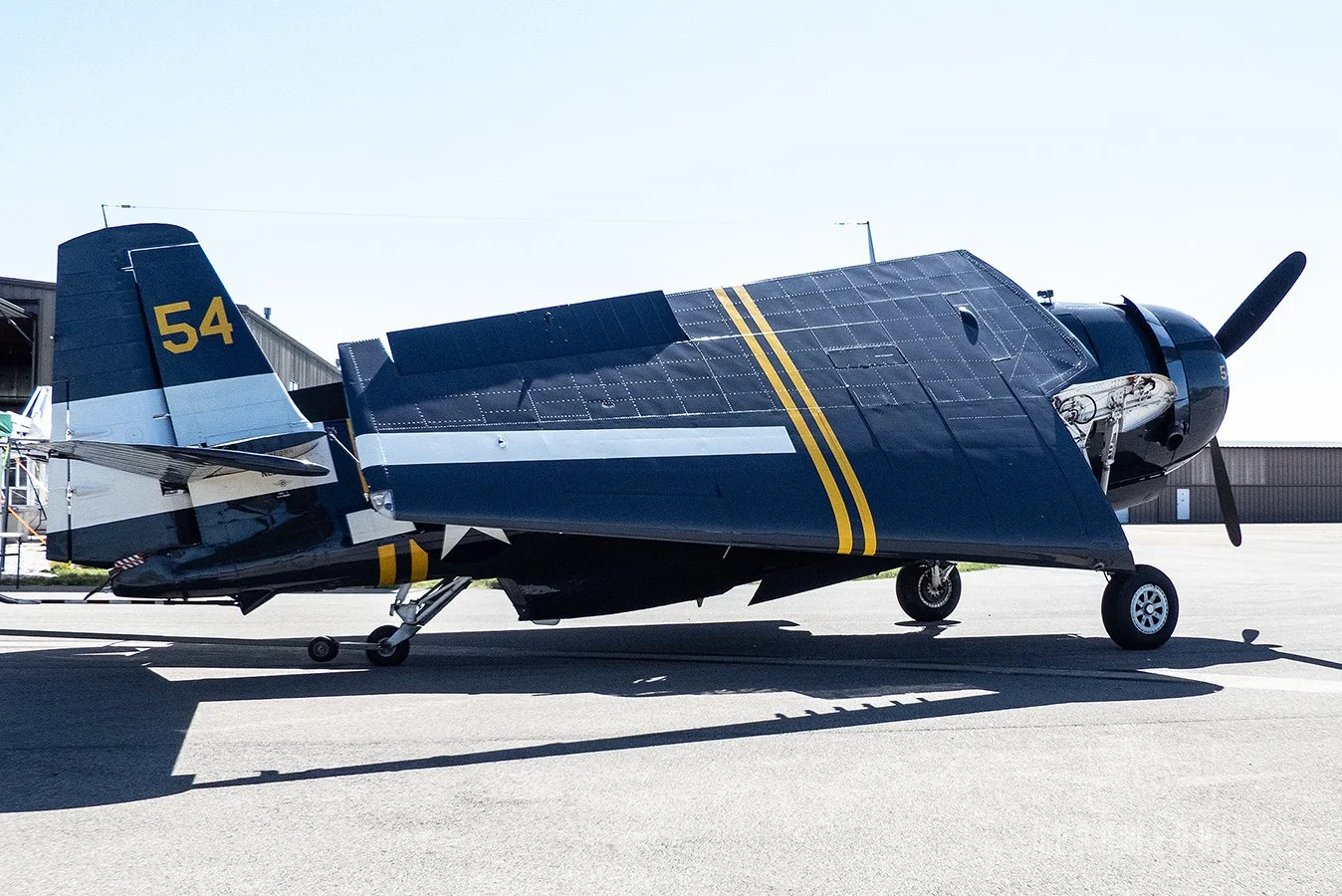 TBM Avenger being pulled out to the flight line.
