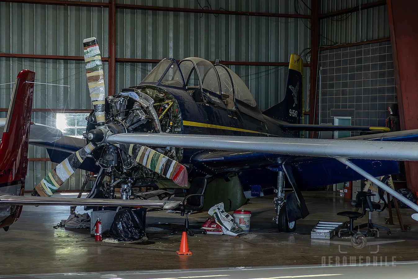 T-28 Trojan in a hanger undergoing repairs. Wings & Wheels - Greeneville Municipal Airport (GCY) 
02May26