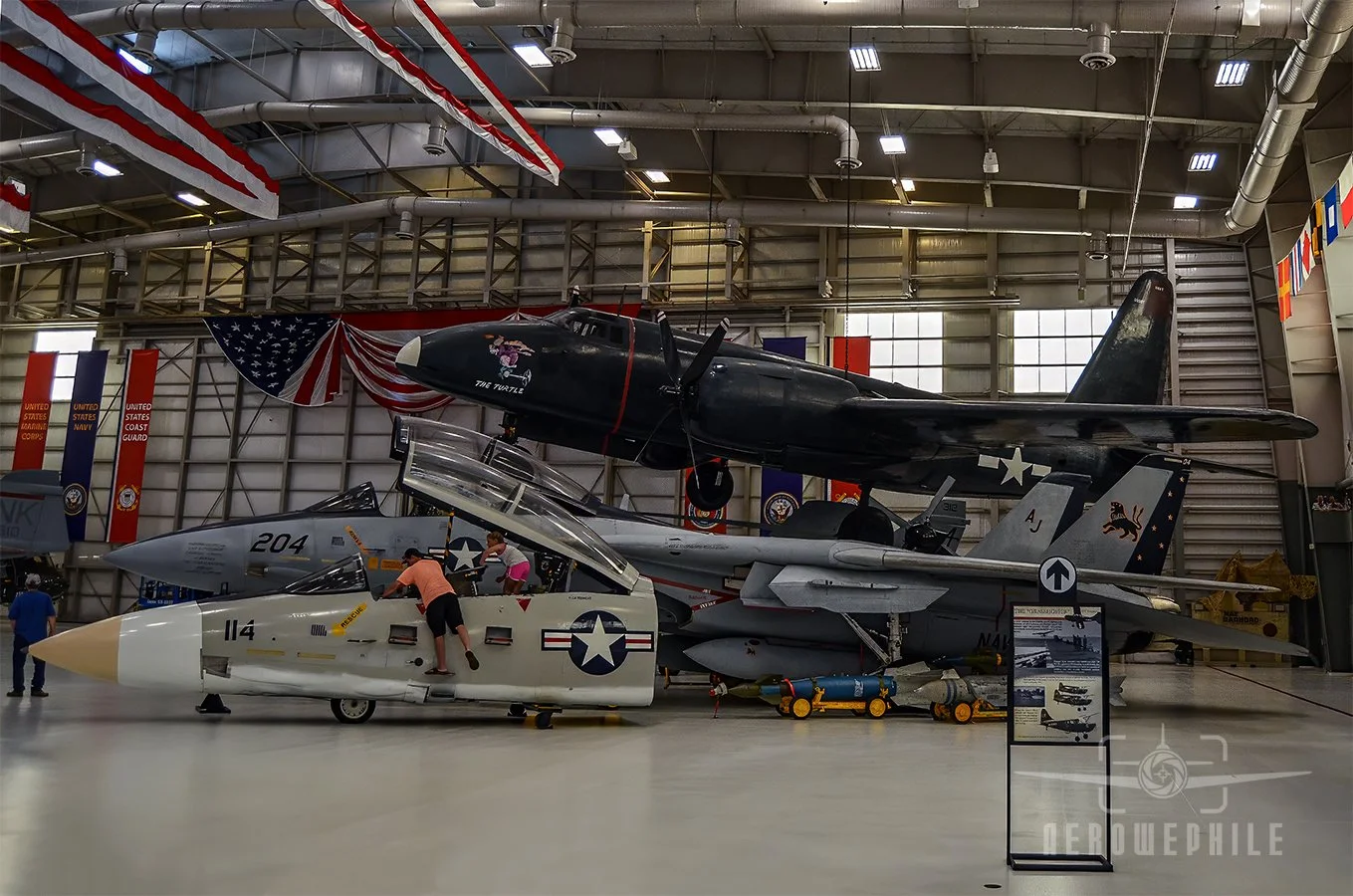 Lockheed P2V-1 Neptune (Truculent Turtle) above the Grumman F-14D(R) Tomcat and Tomcat cockpit section.