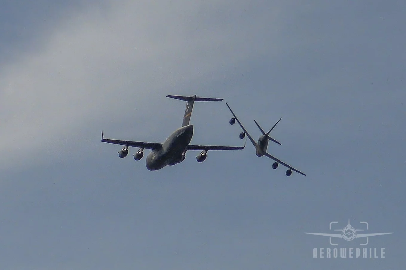 USAF Boeing KC-135 Stratotanker (97th Airlift Wing, Altus AFB, OK) making a right break away from the USAF Boeing C-17A Globemaster III (97th Airlift Wing, Altus AFB, OK).
