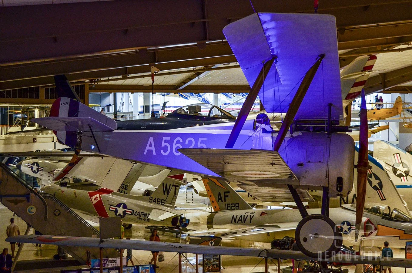 Hanging overhead is the Hanriot HD-1. A capable French fighter, the HD-1 was overshadowed by its contemporary, the SPAD VII, and saw use mostly with Belgian and Italian pilots. After the war, the U.S. Navy acquired several for shipboard evaluation, p