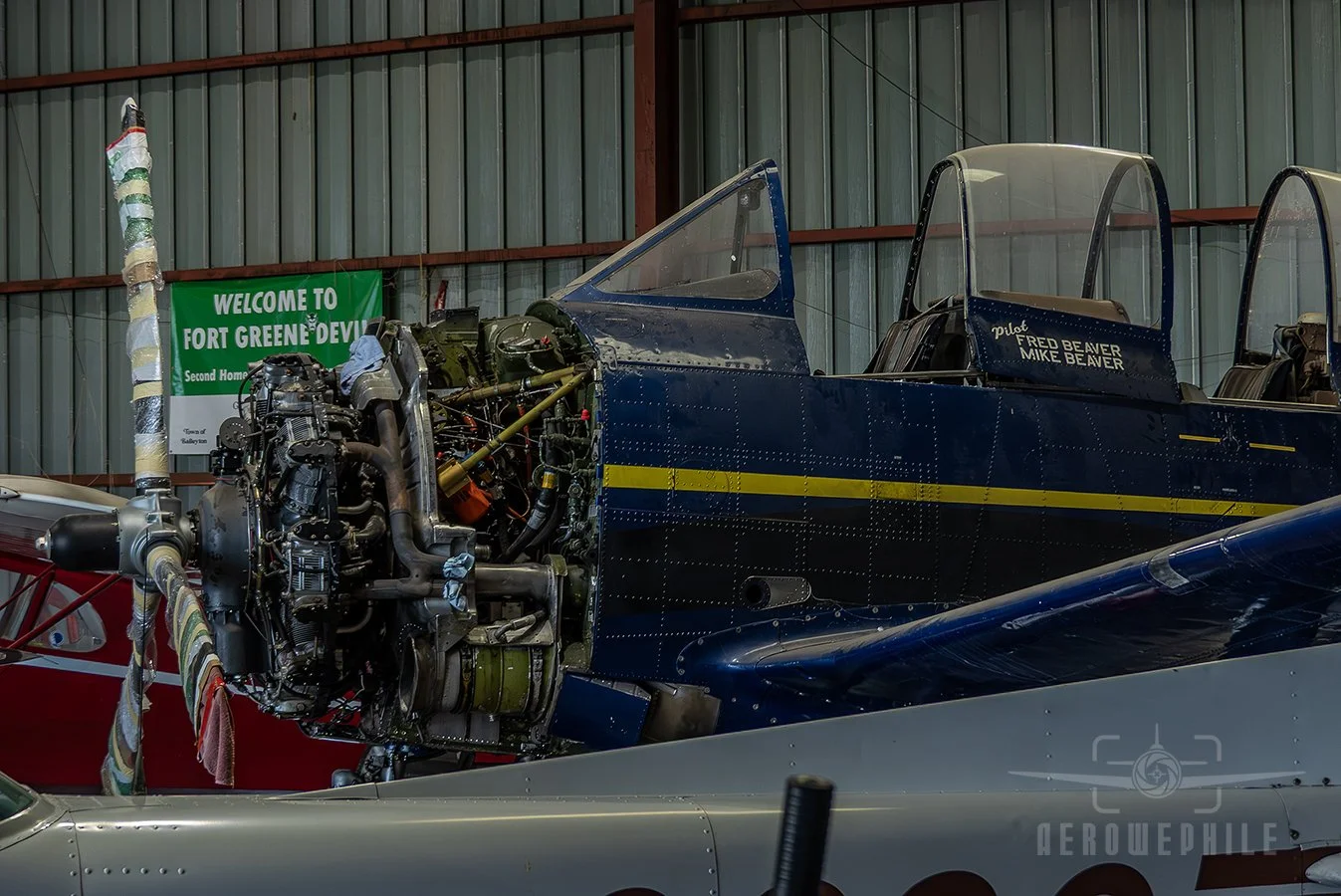 T-28 Trojan in a hanger undergoing repairs. Wings & Wheels - Greeneville Municipal Airport (GCY) 
02May26