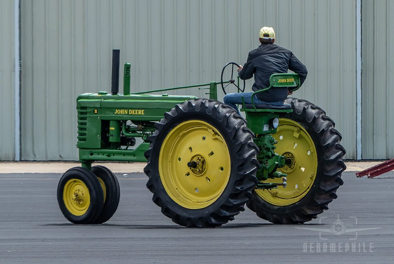 The only "Wheels" photo that I took. A restored classic John Deere Model B tractor. This photo was taken for my father. He sold International Harvester tractors when I was a child.  So I prefer Red over Green. Wings & Wheels - Greeneville Municipal A