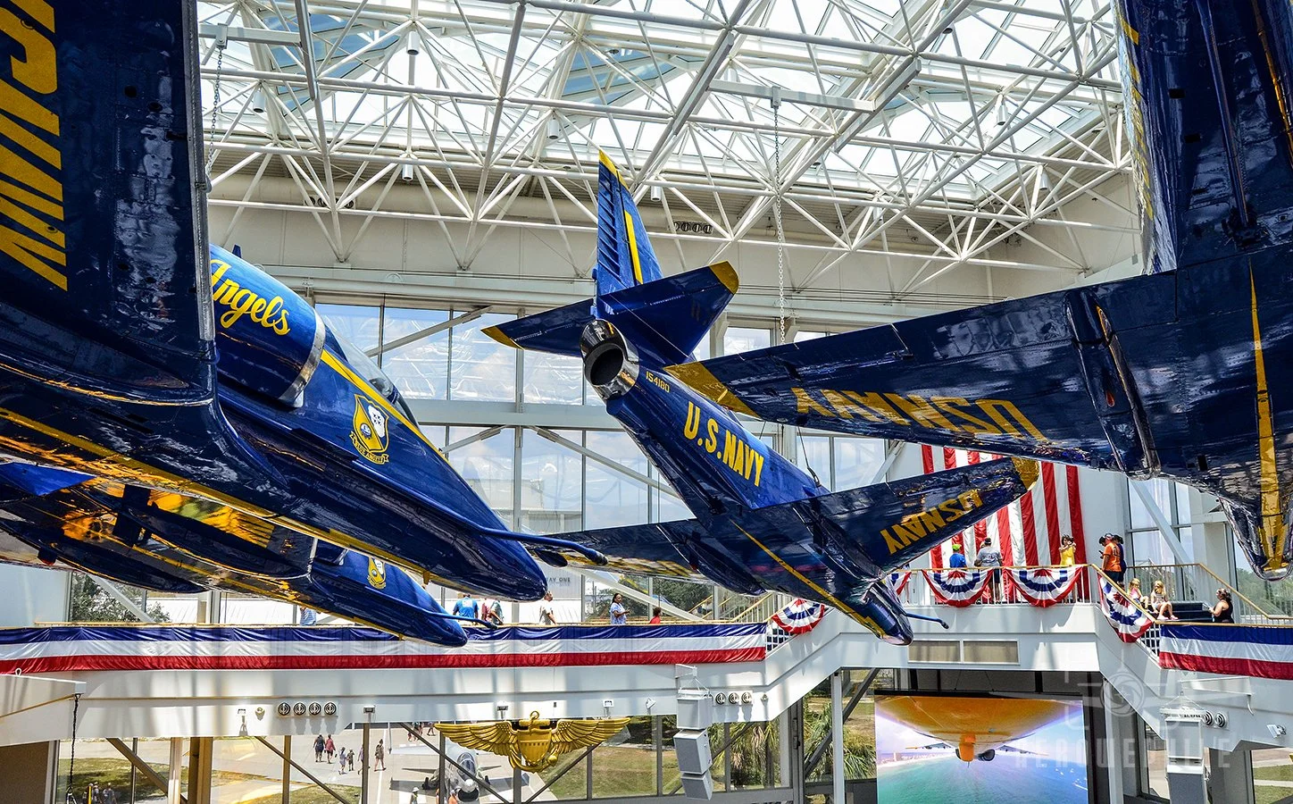 Blue Angels A-4 Skyhawks in the diamond formation suspended in the Blue Angel Atrium.