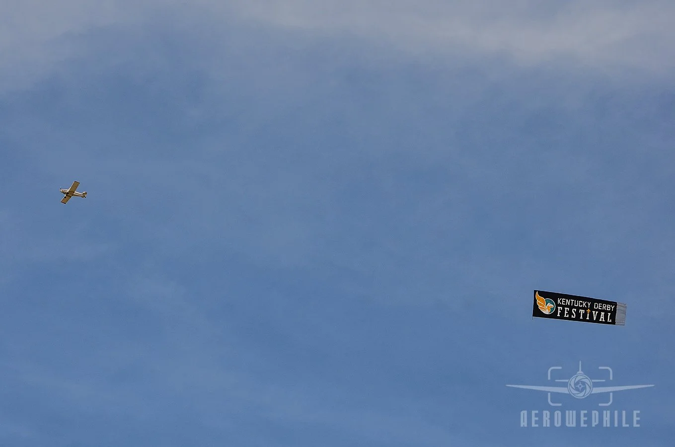 Banner tow plane making lazy circles up and down the waterfront.