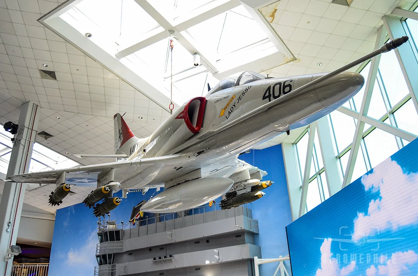 A-4E Skyhawk (Bureau Number 149656) suspended in the Quarterdeck honors Attack Squadrons (VA) 163 and 164.