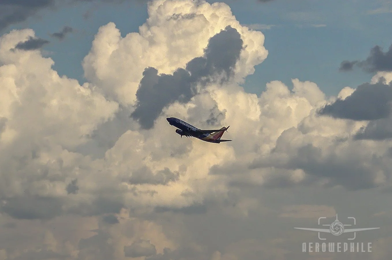 Southwest Airlines Boeing 737 lifting out of Louisville Airport during a break in the action.