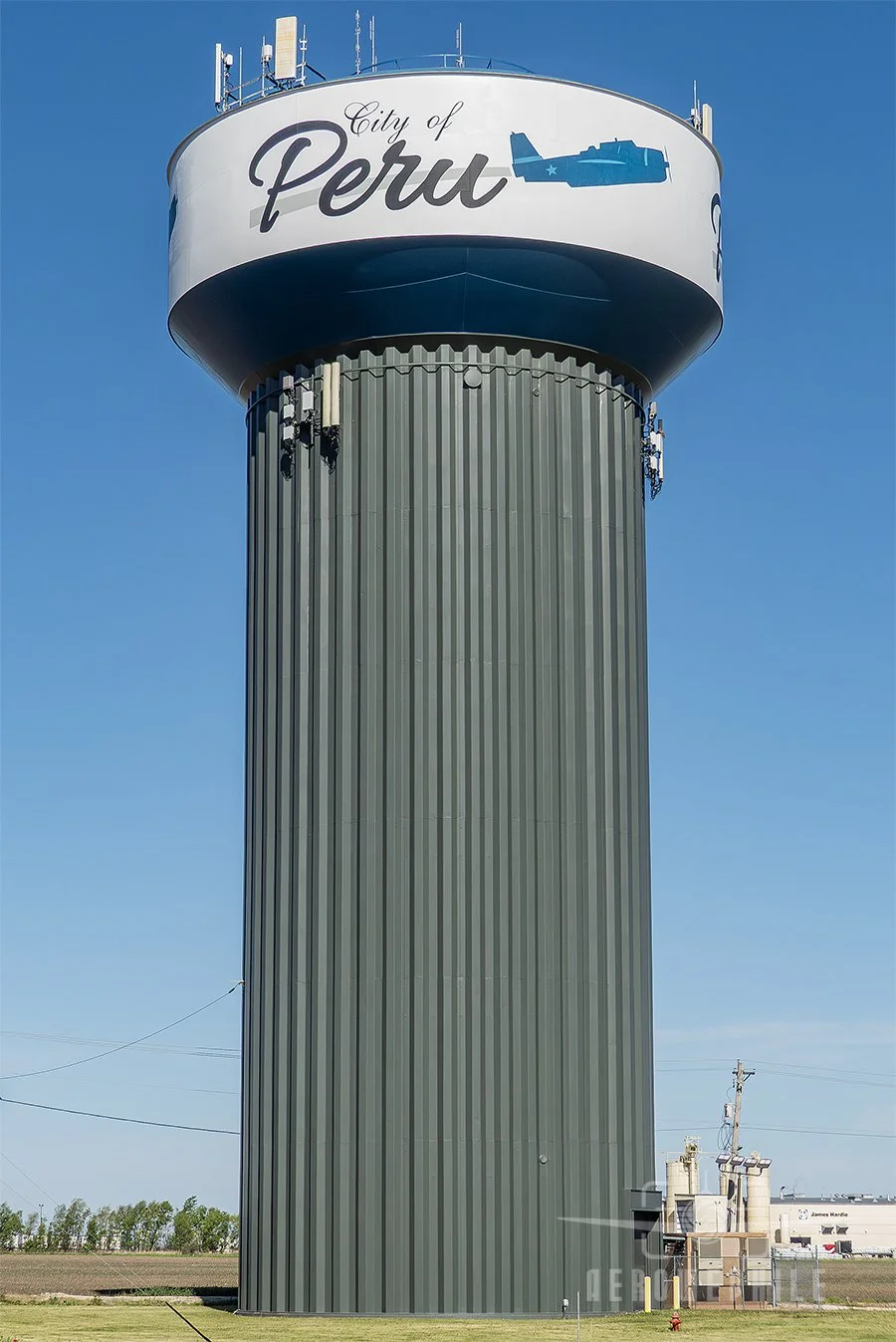 Daytime image of the Peru, Illinois water tower with a TBM Avenger painted on the side.