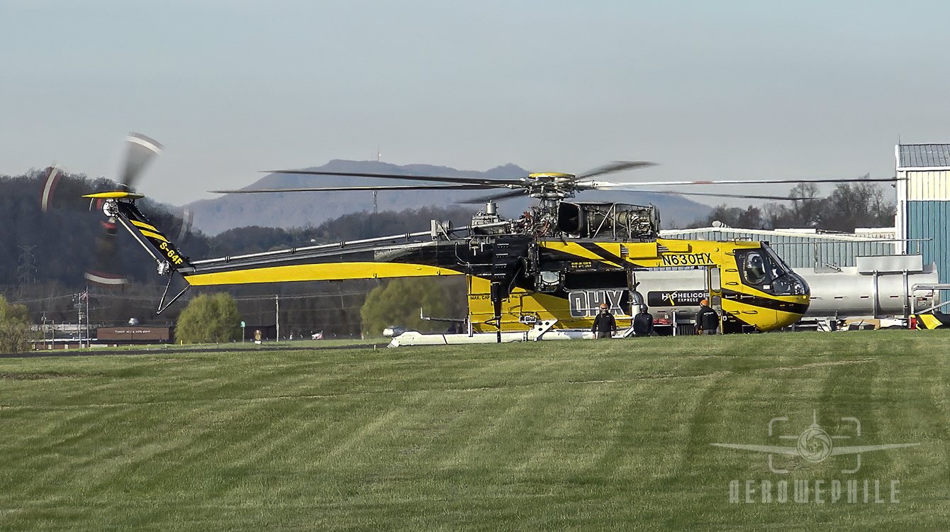 The S-64F Skycrane up and running and I'm excitedly waiting for it to take off. But the ground crew are there walking around and looking at something.
25Mar26