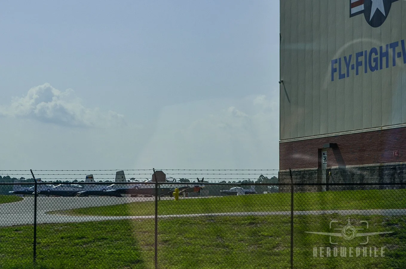 Active duty Beechcraft T-6 Texan II trainers parked on the ramp at NAS Pensacola.