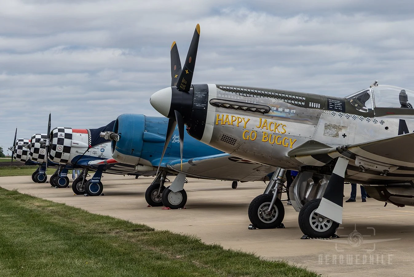 Hot Ramp Flight Line with North American P-51D-30-NA Mustang "Happy Jack's Go Buggy", North American SNJ-5B Texan, and the TITAN Aerobatic Team - North American AT-6 Texans.