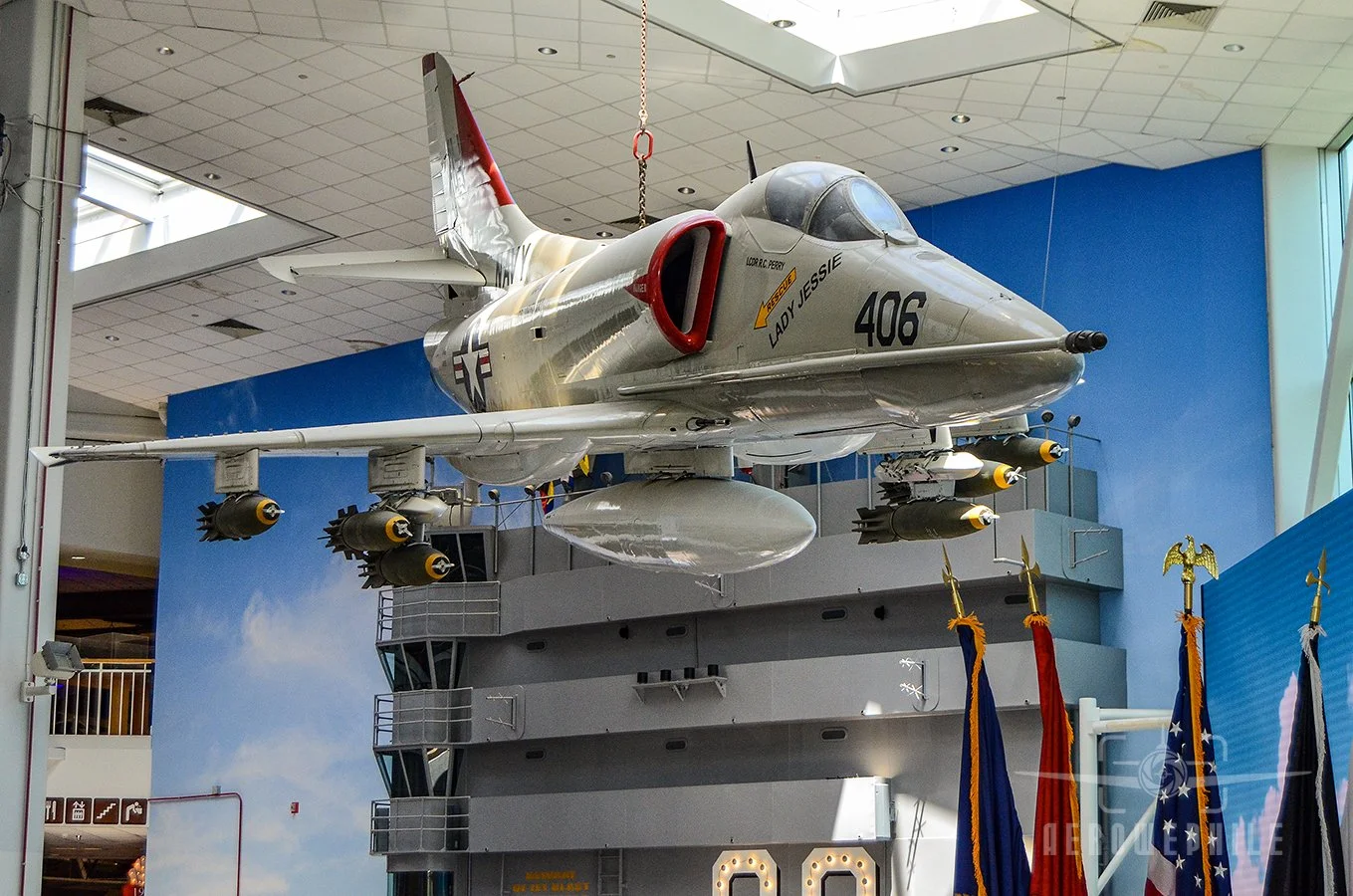 A-4E Skyhawk (Bureau Number 149656) suspended in the Quarterdeck honors Attack Squadrons (VA) 163 and 164.