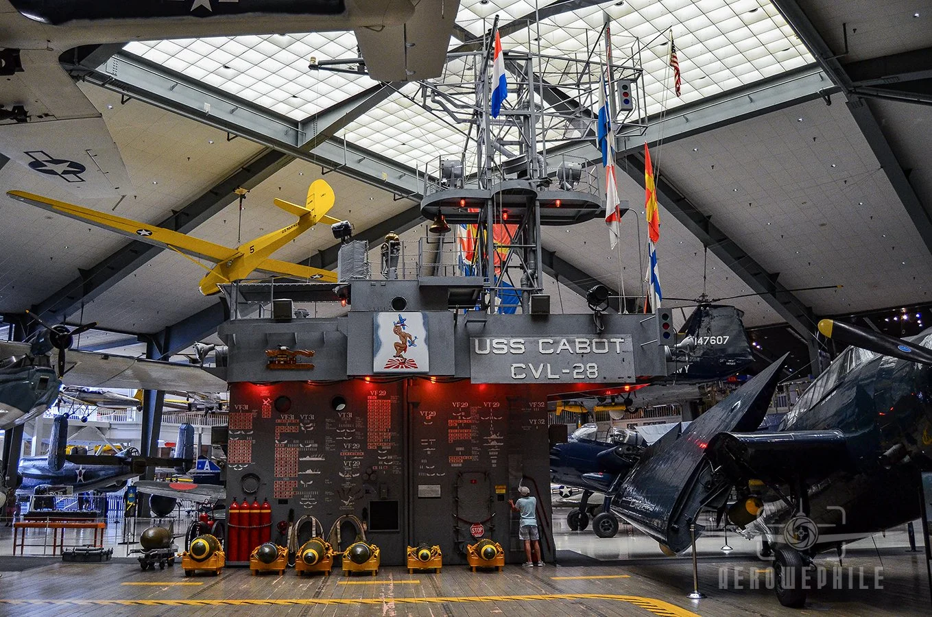 USS Cabot Flight Deck - This exhibit depicts the decorated light carrier USS Cabot (CVL 28) and includes a replica of the wooden flight deck and island superstructure.