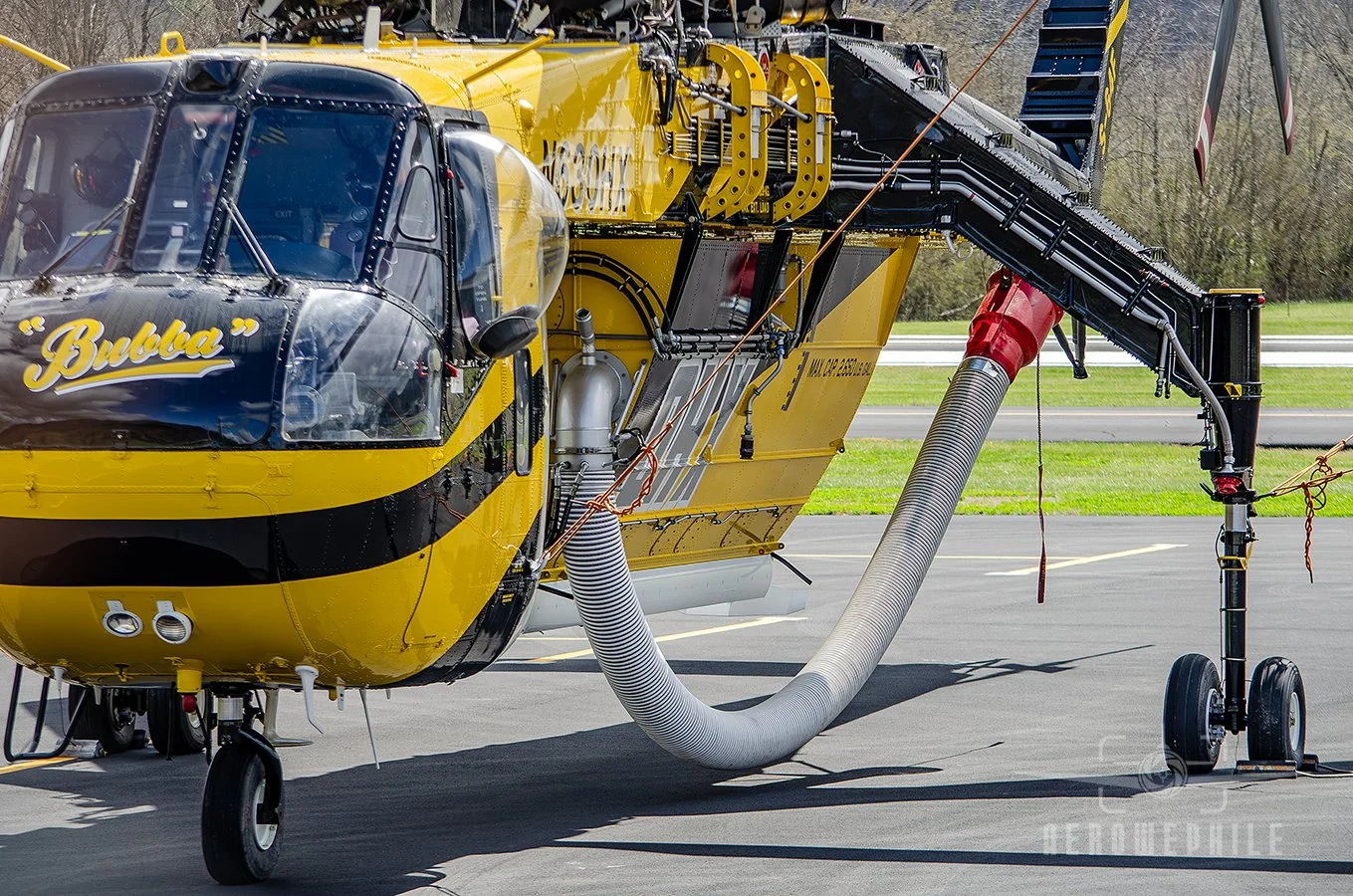 The Helicopter Express Sikorsky S-64F Skycrane is equipped with a 2,600-gallon fire suppression system as a bolt-on accessory. The gigantic snorkle hose is for dipping in the water to fill that massive tank slung between its legs.
23Mar26