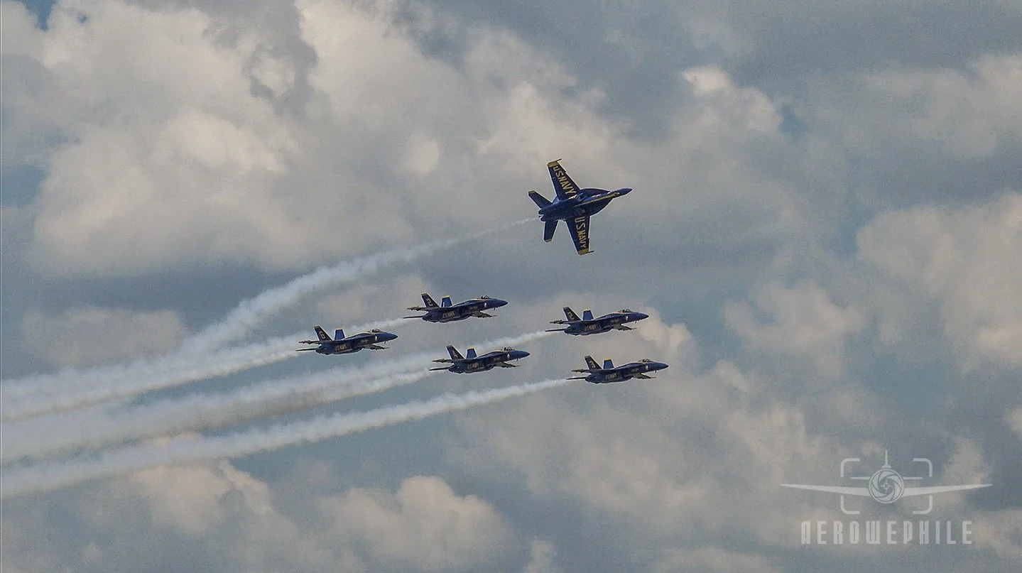Blues formation pass with the first jet breaking out to land.