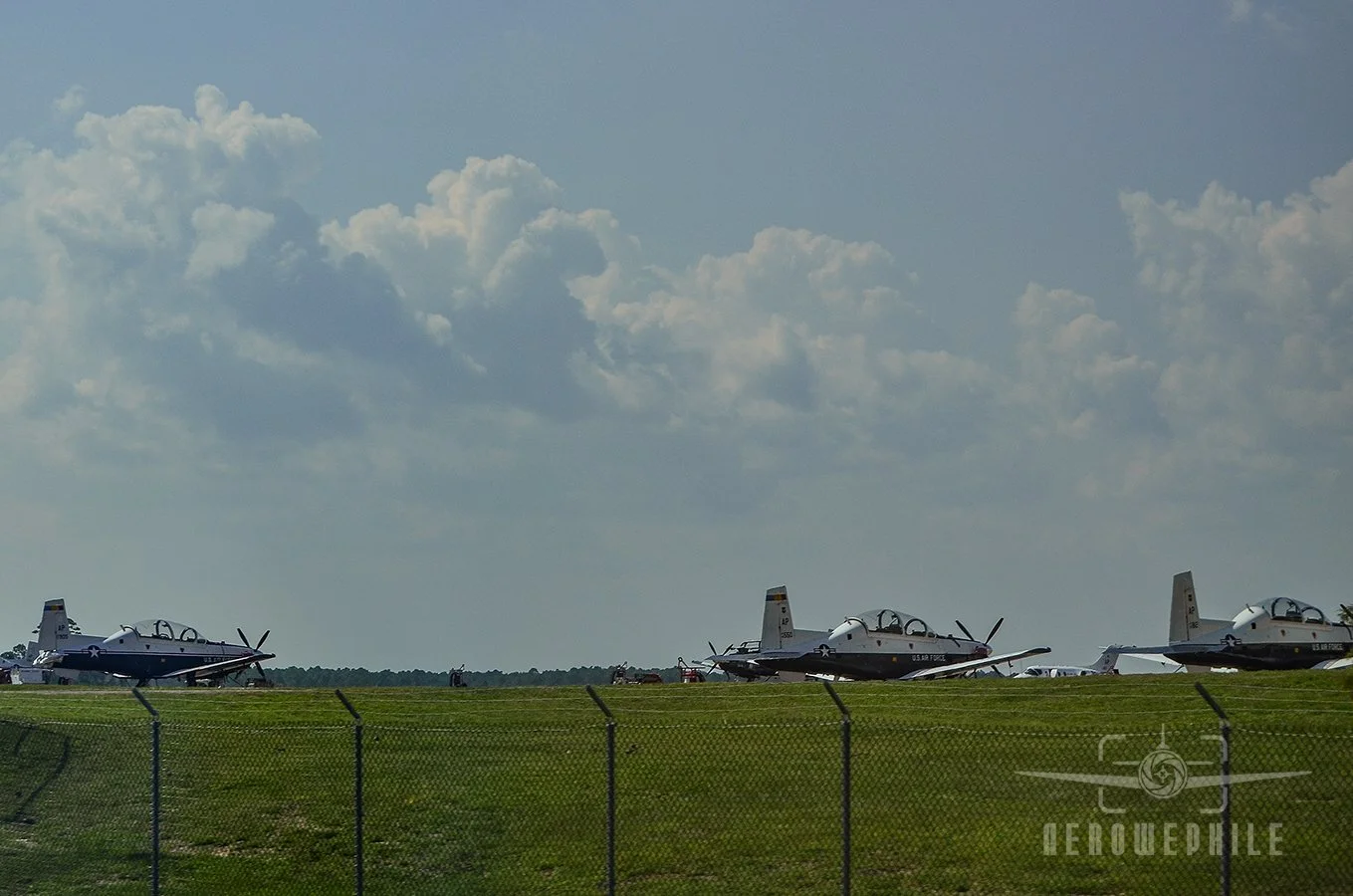 Active duty Beechcraft T-6 Texan II trainers parked on the ramp at NAS Pensacola.