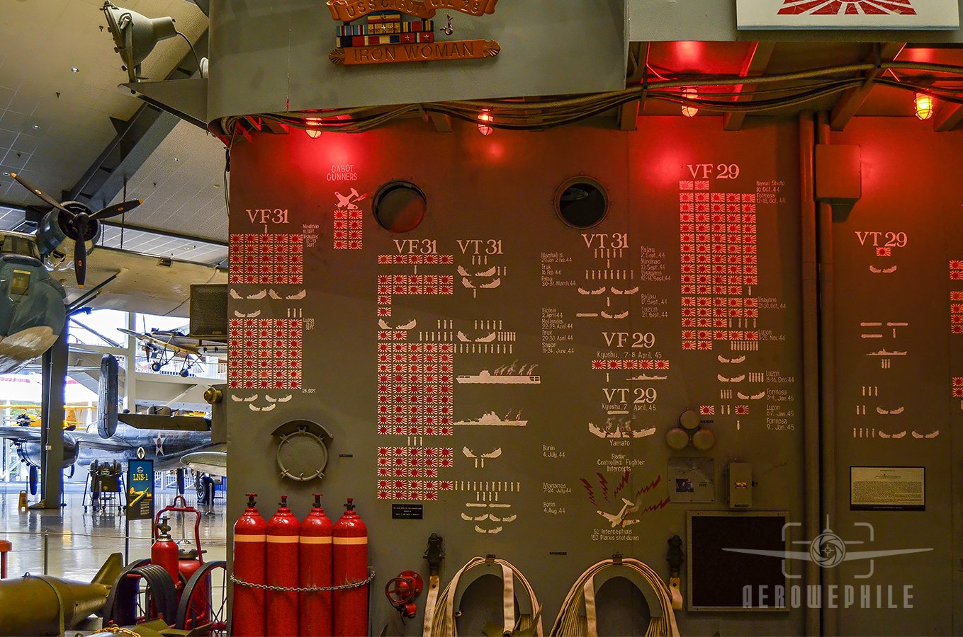 The USS Cabot scoreboard documenting the ship’s combat record was painted by a sailor who completed the original, this time with the assistance of his son.