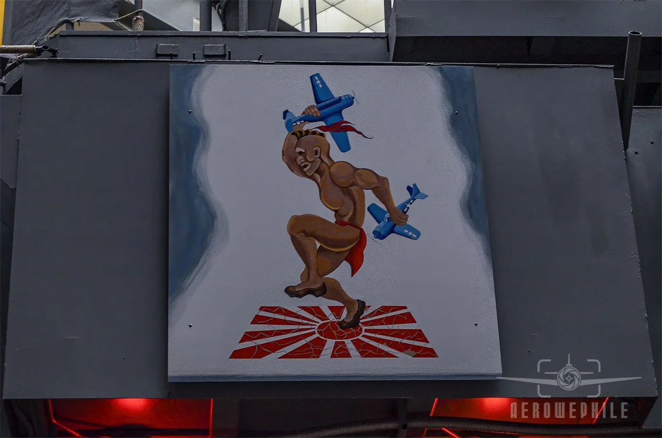 The island features a painting reflecting the ship’s wartime radio callsign “Mohawk” and ribbons noting it combat awards that are topped by a duck decoy.