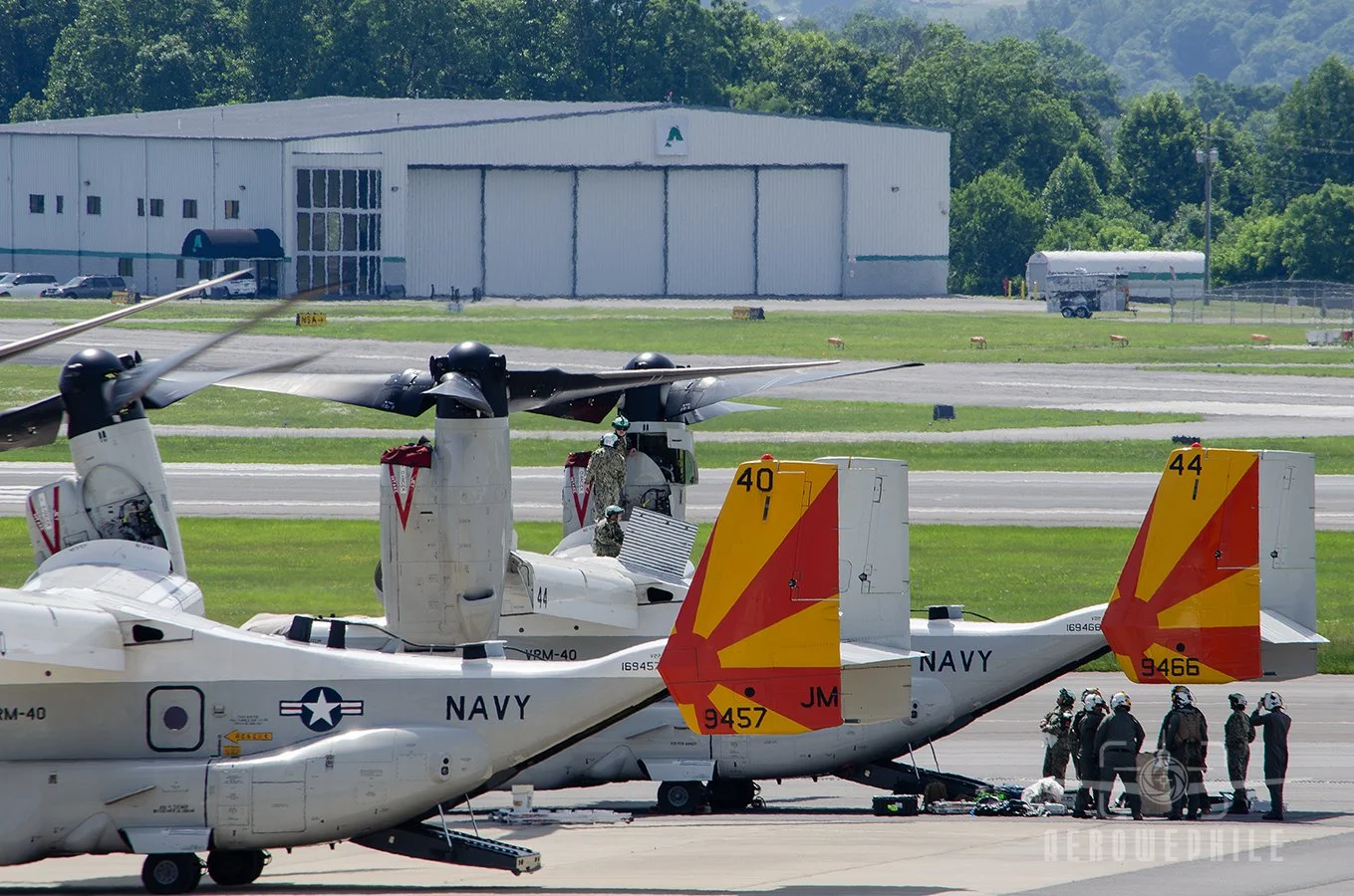 Sailors on the wing of the stricken Osprey. Sailors under the tail of the Osprey getting instructions.
29May26