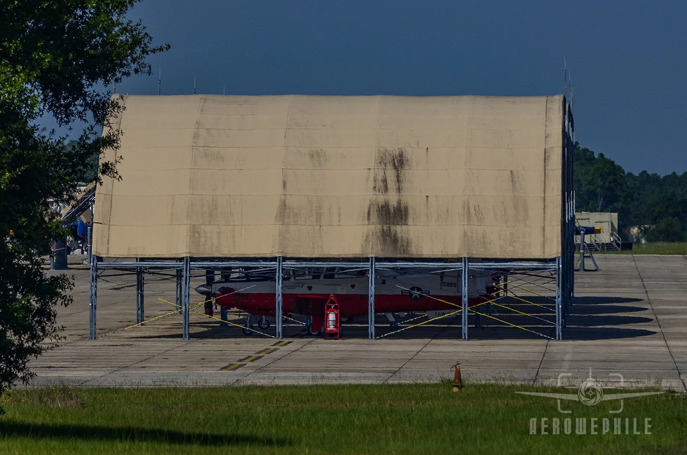 T-6 Texan IIs parked under the dome hangers.